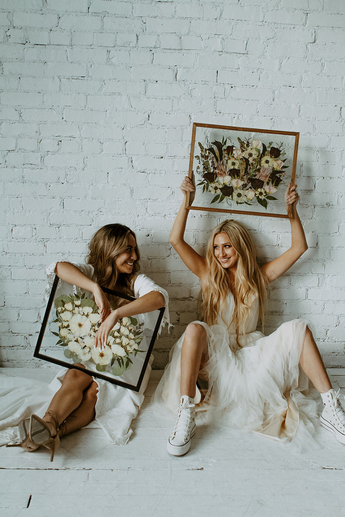 brides holding Pressed and preserved wedding bouquets