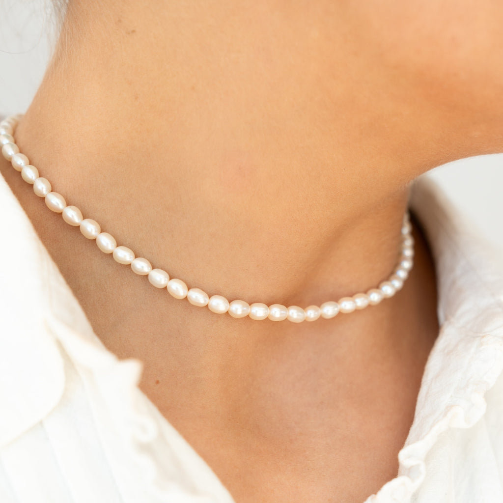 Exquisite and elegant, the gold pearl bridal necklace is crafted with fine pearls to provide the perfect finishing touch for your special day.  The Gold filled pearl necklace is perfect for your special day. Crafted with fresh water pearls, this necklace boasts elevated and sophisticated styles fit for any occasion.   This gold-filled chain is graced with the delicate Fresh water pearls, symbolizing a classy wedding day that the wearer will never forget. 