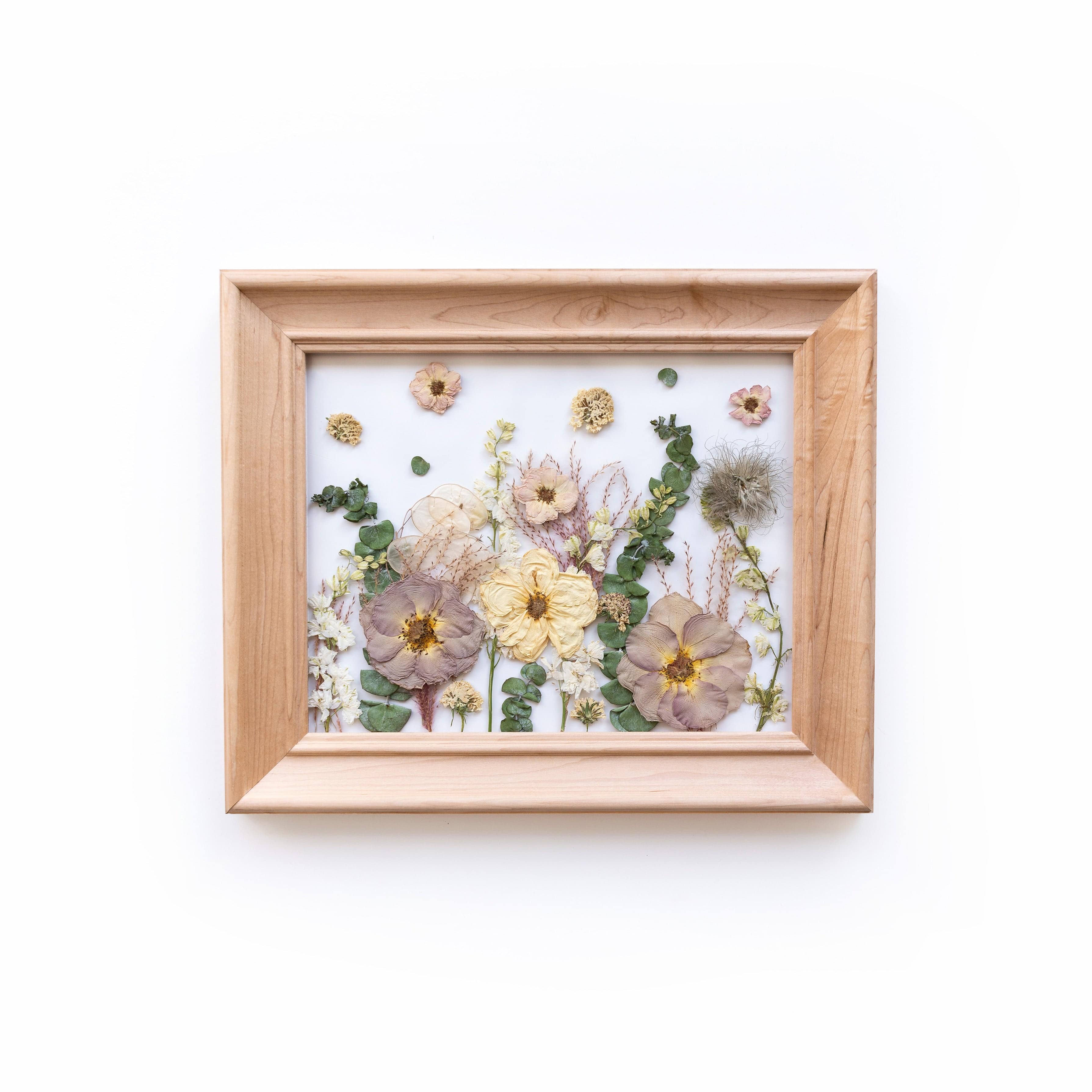 Wedding bouquet professionally preserved in a natural wood frame